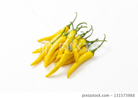 Yellow chili peppers on white background Yellow chili peppers on white background 131573988