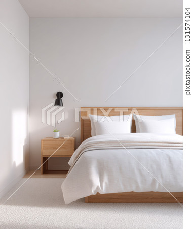 Peaceful minimalist bedroom interior design with wooden bed against white wall. Natural light creates serene and calm feeling. Simple, clean, and modern home decor concept 131574104