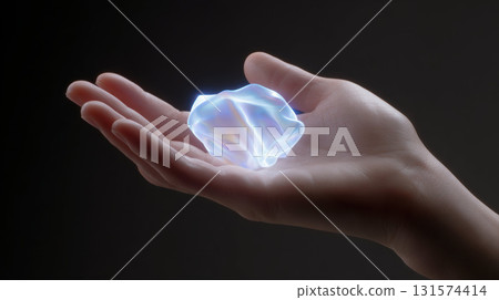Human hand holding glowing fluid light, mysterious concept for future of currency and technology. shapeshift object represents wonder and new potential 131574414