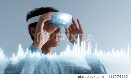 Focused man using an augmented reality goggle headset to visualize data. Exploring future of technology and metaverse with high fidelity virtual reality experience 131574585