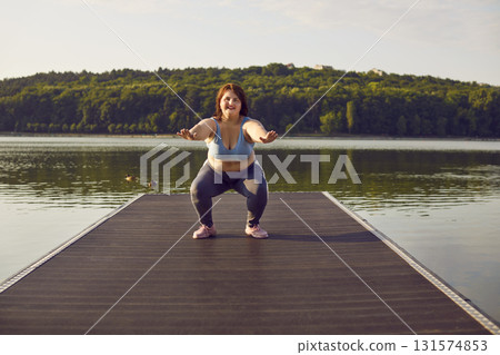 Overweight Woman Exercising Outdoors By River 131574853
