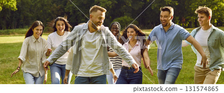 Group of happy, excited young people playing and having fun in the park in the summer Group of happy, excited young people playing and having fun in the park in the summer 131574865