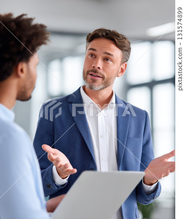 Focused entrepreneurs pitching startup idea in business meeting. confident professional man has serious discussion with colleague in office for project collaboration 131574899
