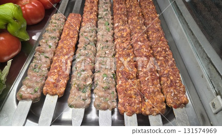 Delicious assorted skewered kebabs with fresh vegetables for grilling enthusiasts and barbecue gatherings. Street food 131574969