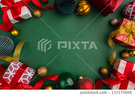 Christmas Gifts and Ornaments Border on Green Background 131575606