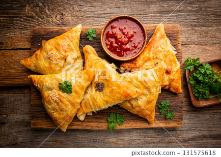 Samsa or samosas with meat 131575618