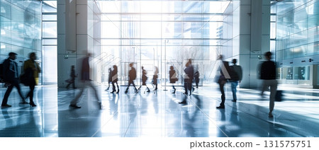 People walking in modern glass office lobby 131575751