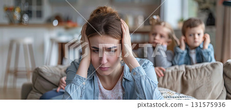 Stressed mother at home with children Stressed mother at home with children 131575936