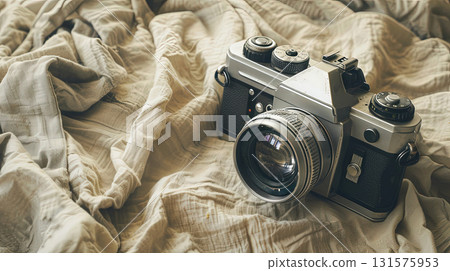 Vintage film camera on fabric with artistic light 131575953