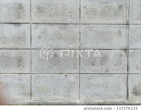 Close up view of weathered concrete wall with visible stains, cracks, and dirt, showing aged and rough surface texture Close up view of weathered concrete wall with visible stains, cracks, and dirt, showing aged and rough surface texture 131576133