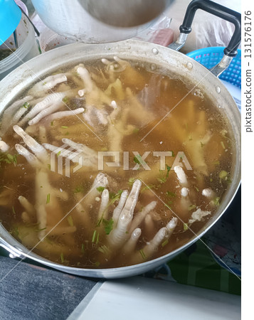 Chicken feet soup chicken foot broth soup stock poultry boiled simmering pot cilantro Chicken feet soup chicken foot broth soup stock poultry boiled simmering pot cilantro 131576176