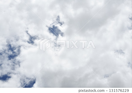 White cloud sky blue peaceful atmosphere with soft fluffy cloud formation creating calm natural scene 131576229