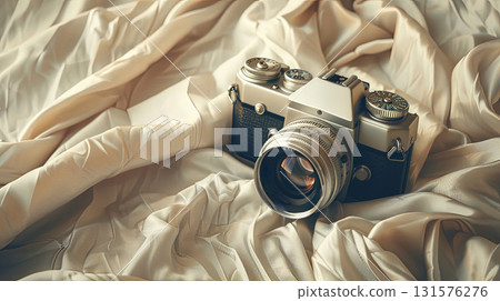 Vintage film camera on fabric with artistic light Vintage film camera on fabric with artistic light 131576276