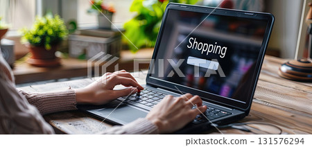 Woman shopping online with laptop at home Woman shopping online with laptop at home 131576294