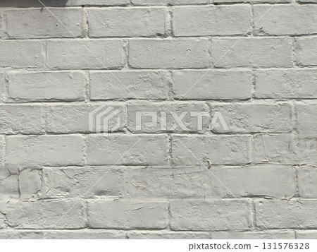 Painted brick wall texture with subtle shadow and rough mortar giving urban neutral backdrop for design and architecture projects Painted brick wall texture with subtle shadow and rough mortar giving urban neutral backdrop for design and architecture projects 131576328