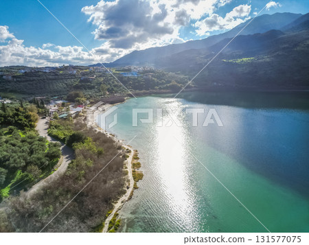 Scenic Lake Kournas in Crete on sunny day aerial view. Scenic Lake Kournas in Crete on sunny day aerial view. 131577075
