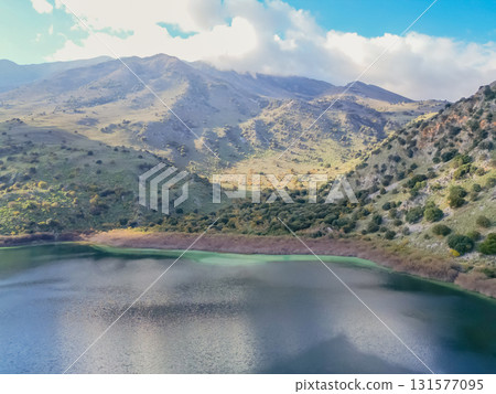 Scenic Lake Kournas in Crete on sunny day aerial view. Scenic Lake Kournas in Crete on sunny day aerial view. 131577095