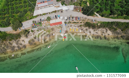 Lake Kournas in Crete aerial view of pedal boat rental clear water and scenic Greek nature. Lake Kournas in Crete aerial view of pedal boat rental clear water and scenic Greek nature. 131577099