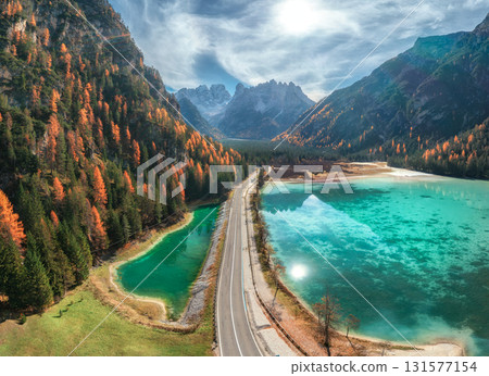 Aerial view of road, azure lakes, forest in mountains in autumn Aerial view of road, azure lakes, forest in mountains in autumn 131577154