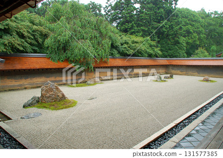 Kyoto Ryoanji Temple: Rock garden and clay wall with persimmon roof Kyoto Ryoanji Temple: Rock garden and clay wall with persimmon roof 131577385