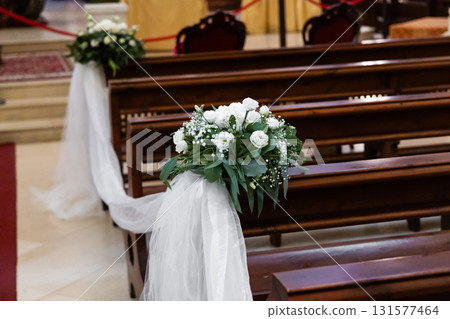 Wedding decorations with white ribbons and flowers Wedding decorations with white ribbons and flowers 131577464