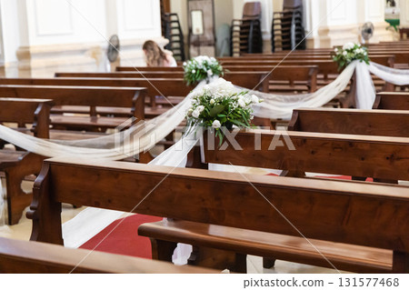 Empty catholic church interior prepared for wedding Empty catholic church interior prepared for wedding 131577468