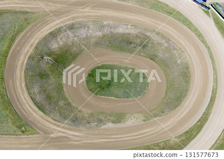Aerial view of an oval shaped dirt speedway race track 131577673