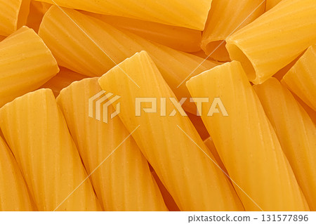 A close up of yellow pasta with a grainy texture A close up of yellow pasta with a grainy texture 131577896