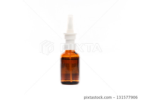 A brown bottle with a white cap and a white label A brown bottle with a white cap and a white label 131577906