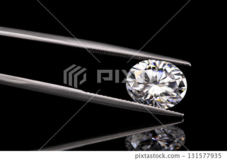 A diamond is displayed in a diamond setting A diamond is displayed in a diamond setting 131577935