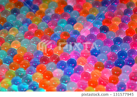A colorful array of small, clear, and colorful balls 131577945