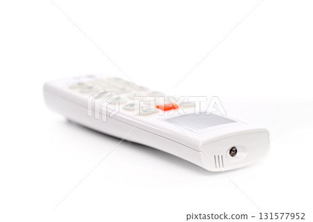 A white air conditioner remote control with a black button on the bottom A white air conditioner remote control with a black button on the bottom 131577952