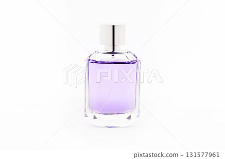 A bottle of purple perfume with a silver cap 131577961