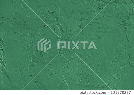 Close up green colored painted plaster wall surface background with rough brushstrokes texture Close up green colored painted plaster wall surface background with rough brushstrokes texture 131578287