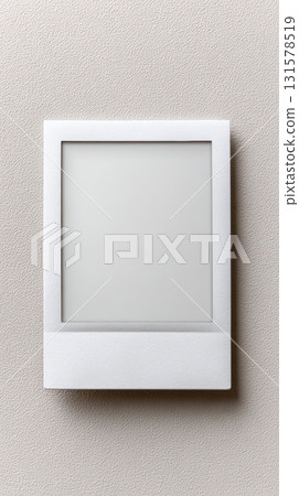 A simple mockup featuring a blank Polaroid frame on a clean white background, perfect for displaying creative designs or personal photos 131578519