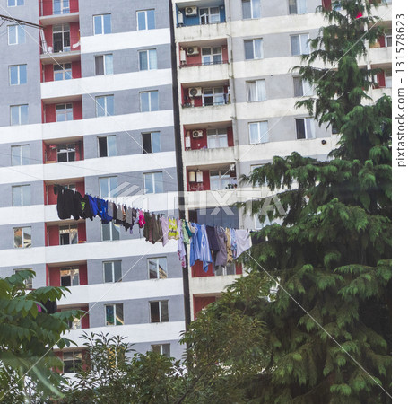 Wet clothes hanged on the rope outside 131578623