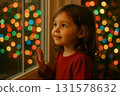 Little girl watching colorful lights through window 131578632