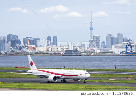 Autumn at Haneda Airport: Government plane taxiing and Skytree, Ota Ward, Tokyo 131578686
