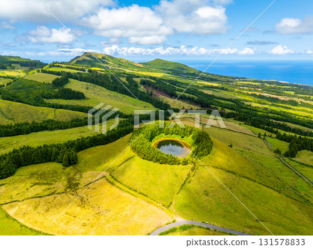 Pond Pau Pique and Lush Green Hills. Atlantic Ocean, Azores, Sao Miguel Island. Portugal. Aerial 131578833