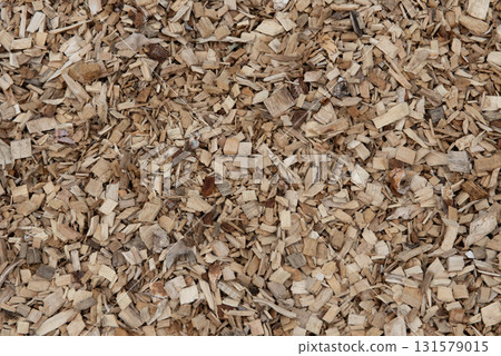 Background, large pile of wood chips on forest edge Background, large pile of wood chips on forest edge 131579015