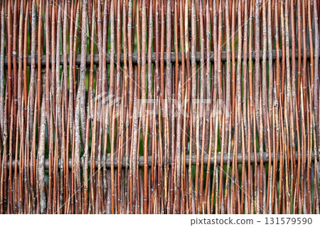 Close-Up Of Woven Natural Wicker Pattern Texture Creating Organic Background With Rustic Earthy Colors And Intricate Weave Details Close-Up Of Woven Natural Wicker Pattern Texture Creating Organic Background With Rustic Earthy Colors And Intricate Weave Details 131579590
