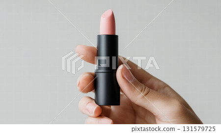 A woman hand holding a lipstick mockup A woman hand holding a lipstick mockup 131579725