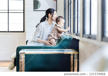 A family relaxing in the living room 131579908