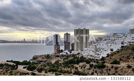 Experience stunning aerial views of a vibrant city and ocean Experience stunning aerial views of a vibrant city and ocean 131580112