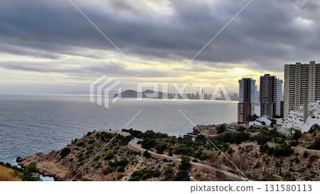 Capture the coastal citys beauty from a cliff, blending nature and city 131580113