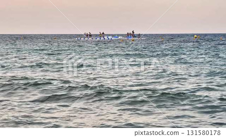 Friends enjoy a thrilling day at sea, riding jet skis and bonding 131580178