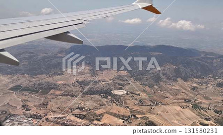 A Stunning and Scenic Aerial View of the Mountainous Landscape as Seen from an Airplane A Stunning and Scenic Aerial View of the Mountainous Landscape as Seen from an Airplane 131580231