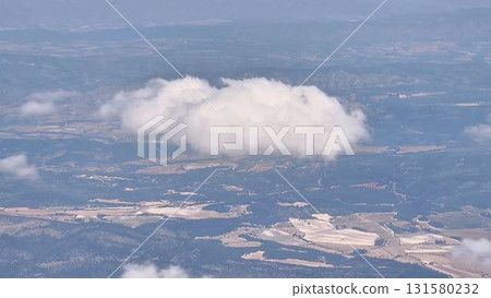 A Stunning Aerial View Capturing the Scenic Cloud Formation Over a Vast Landscape Below A Stunning Aerial View Capturing the Scenic Cloud Formation Over a Vast Landscape Below 131580232