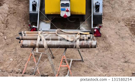 Heavy Construction Equipment with Pipe Support at a Job Site for Various Tasks and Needs Heavy Construction Equipment with Pipe Support at a Job Site for Various Tasks and Needs 131580254
