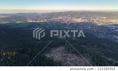 Aerial View of a Beautiful City and Expansive Forest Landscape at Early Dawn Light Aerial View of a Beautiful City and Expansive Forest Landscape at Early Dawn Light 131580302